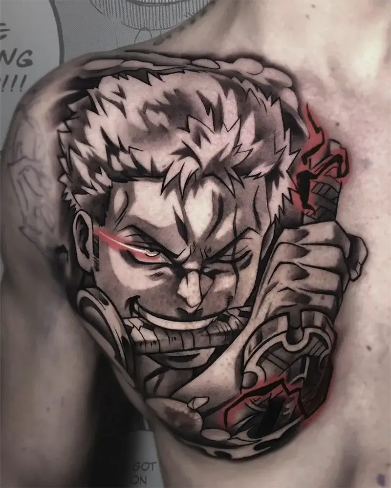Tatuaje anime de Roronoa Zoro de One Piece en el pecho realizado en Yokai Tattoo en Málaga