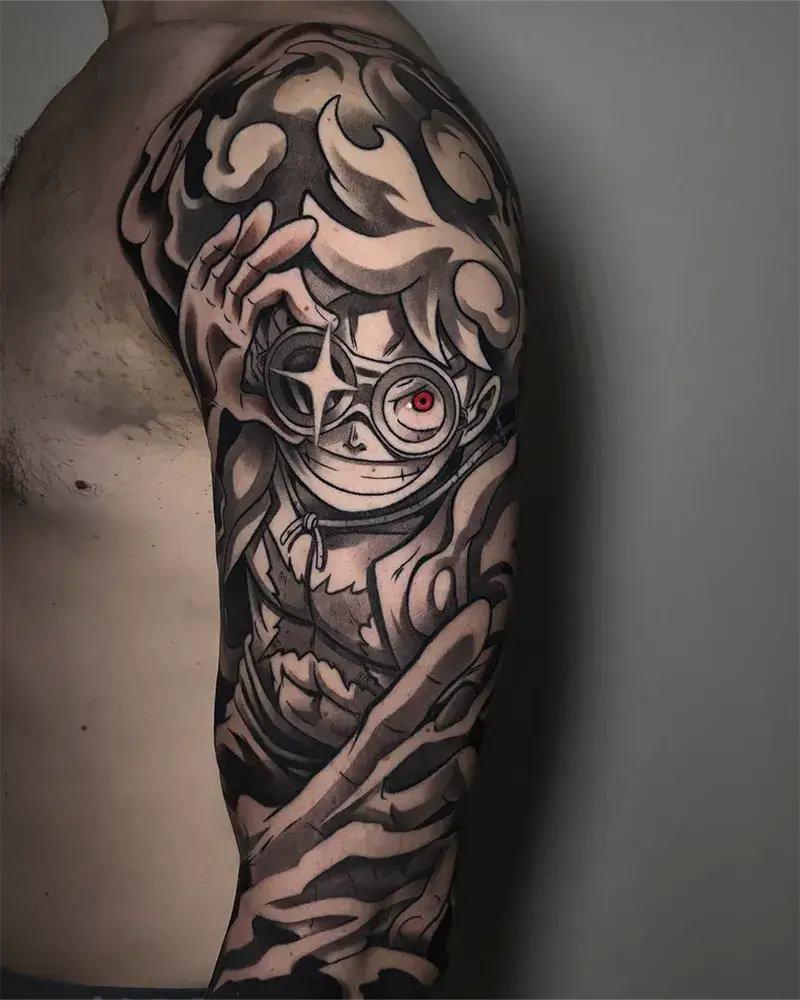 Tatuaje anime de Luffy Gear 5 de One Piece en blanco y negro realizado en Yokai Tattoo en Málaga